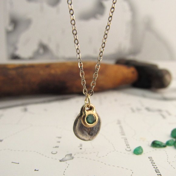 Necklace. Silver necklace with silver and gold pendants Inlaid with Emerald.